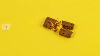 Chocolate pieces on a yellow background, from a stop-motion product film