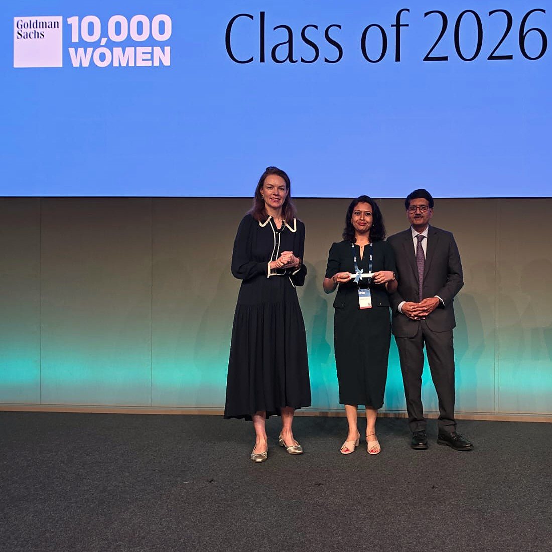 Vipasha Kiran receiving her Goldman Sachs 10,000 Women certificate on stage, Class of 2026